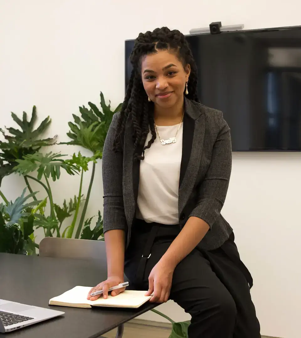Smatbiz business plan writer at her desk preparing a custom business plan for a South African client